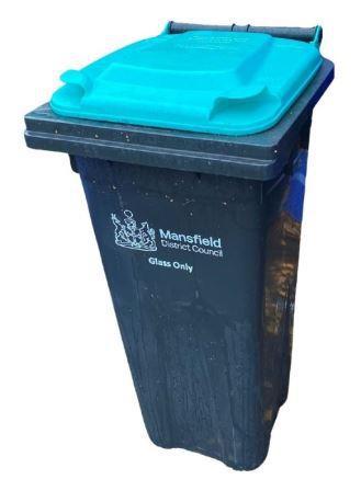 A photo of a MDC glass wheeled bin