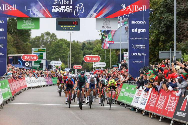 A photo of the cyclists crossing the finish line for Tour of Britain 2022