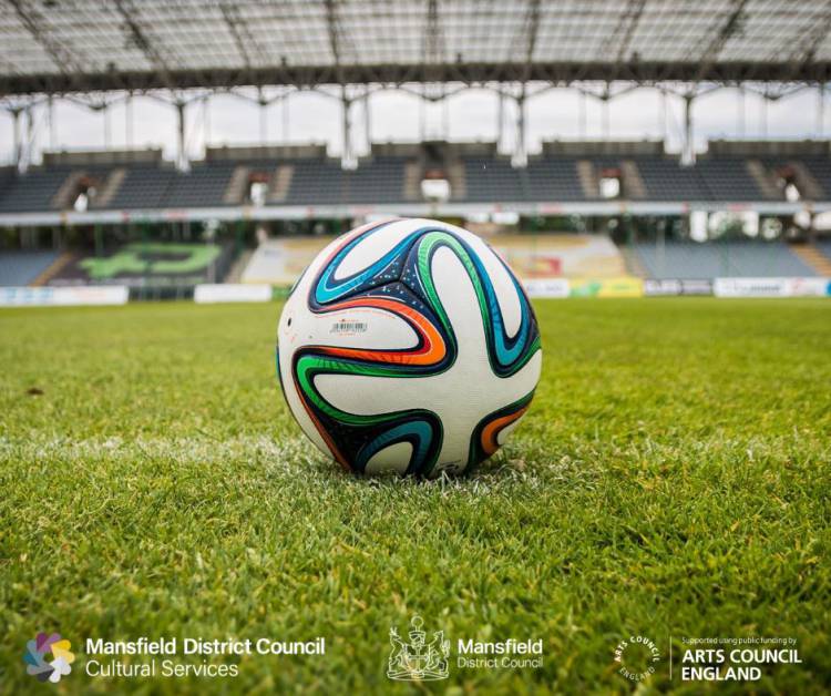 Photo of a football on a football pitch