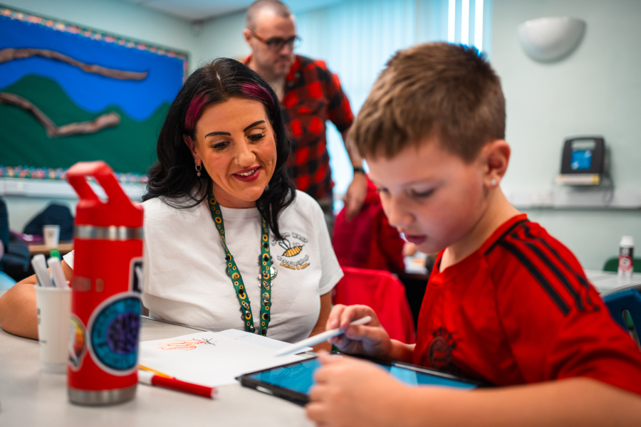 A young person engaging with the workshop that has generated artwork that forms an exhibition at Mansfield Museum