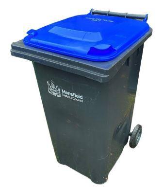 A photo of a MDC recycling wheeled bin