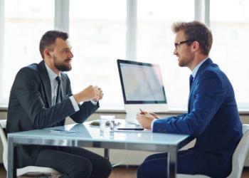 An image of two business men speaking