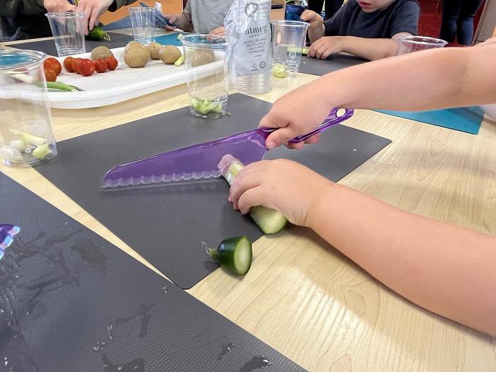 Children learning how to chop, cut and grow