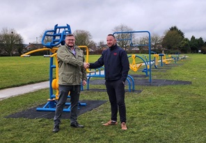 Cllr Whitby at the official handover of the equiopment at Manor Park from a representative of Wicksteed