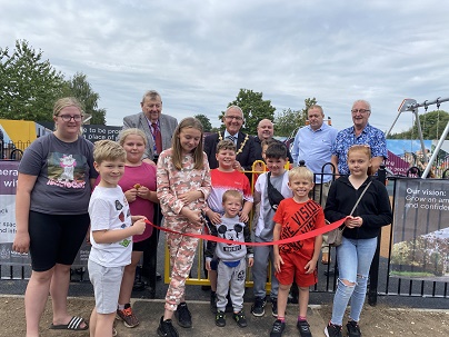 Photo of Cllr Stuart Richardson, community champions and children opening the new play area on the Bellamy estate in Mansfield
