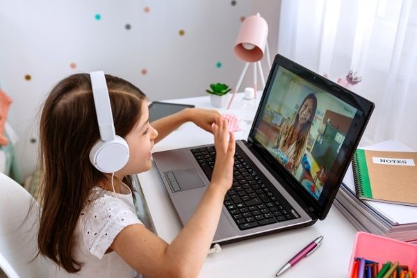 A picture of a young girl on a laptop