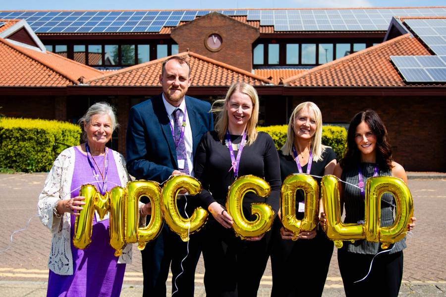 Cllr Anne Callaghan, James Biddlestone, Mallory Seddon, Jill Finnesey, and Libby Alvey celebrate achieving DAHA gold