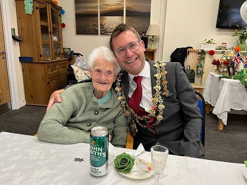 A photo of 104 year old resident Doll Smith and Mayor Andy Abrahams