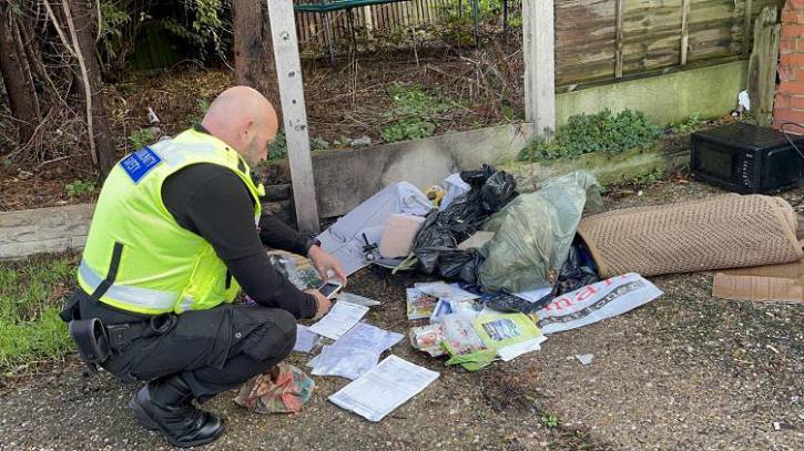 Community Safety officer inspects fly-tip