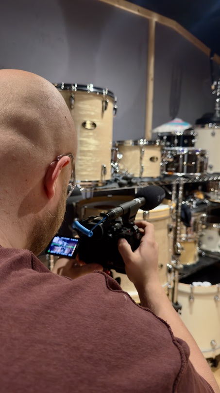 Photo of Electric Bear director using a new video camera