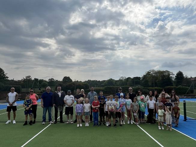 Photo showing people at the reopening of renovated tennis courts at Racecourse Park in Mansfield