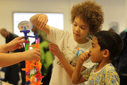 Photo of children playing with a marble run