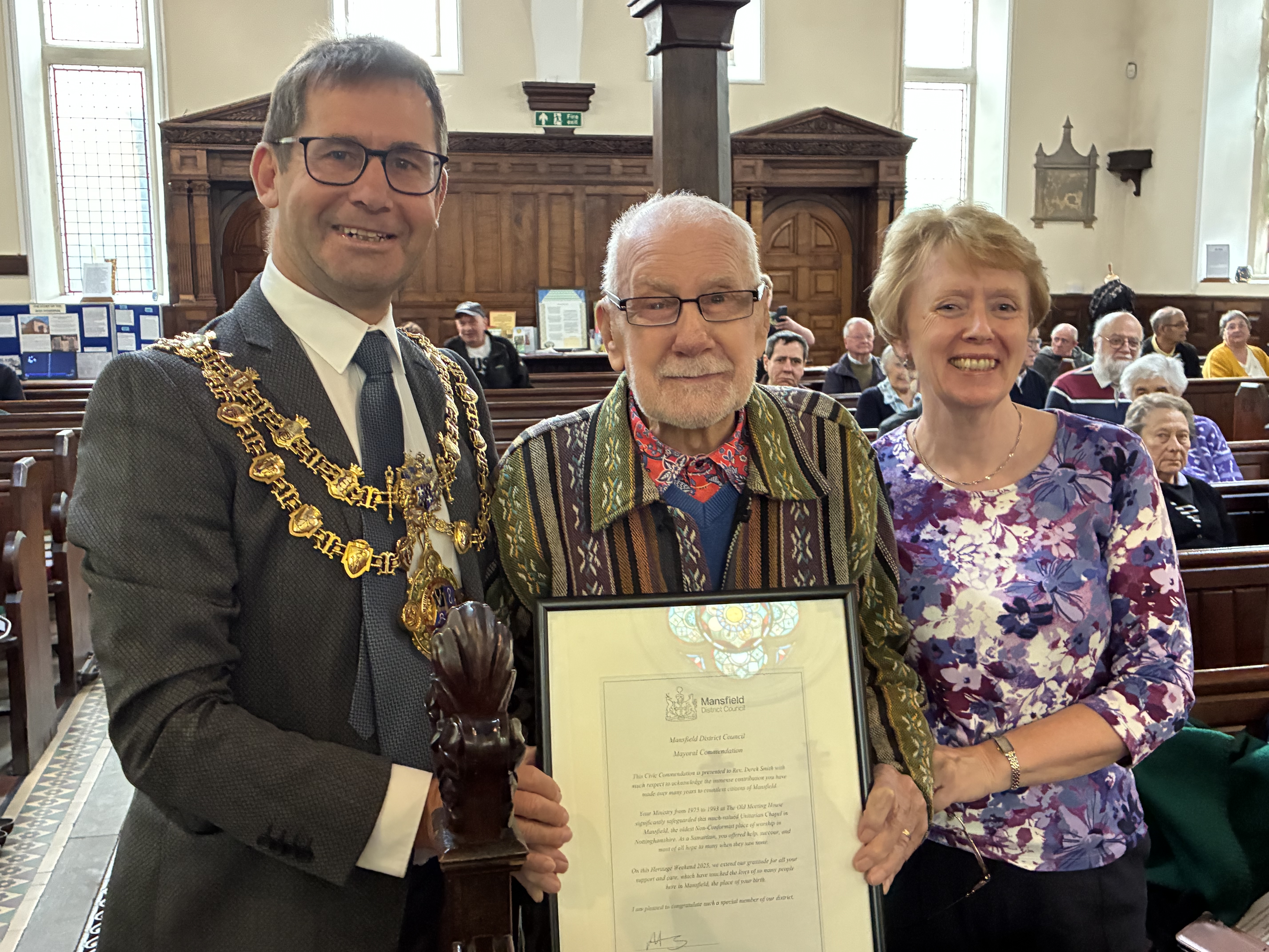 Mayor Andy Abrahams presents Derek Smith and wife Pauline with his Mayoral commendation
