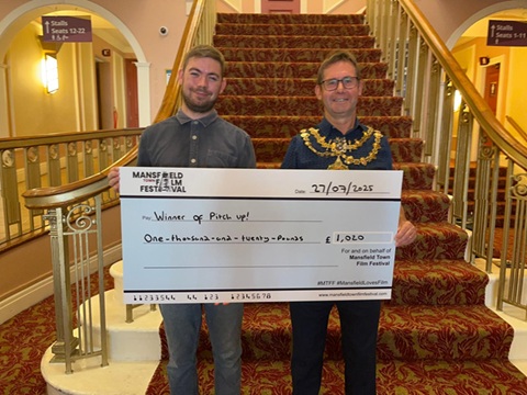 Director of Mansfield Town Film Festival Jay Martin and Executive Mayor Andy Abrahams with a giant cheque for £1,020.