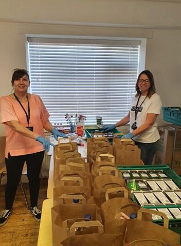 Jeanette Samways and colleague sorting food parcels
