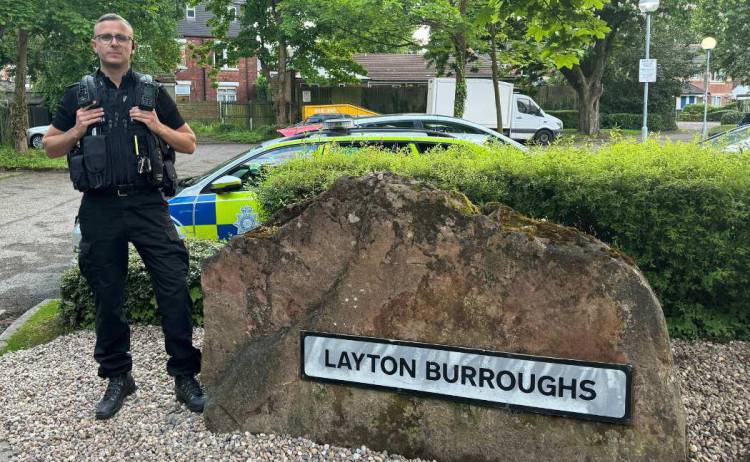 Police stood next to a sign saying Layton Boroughs