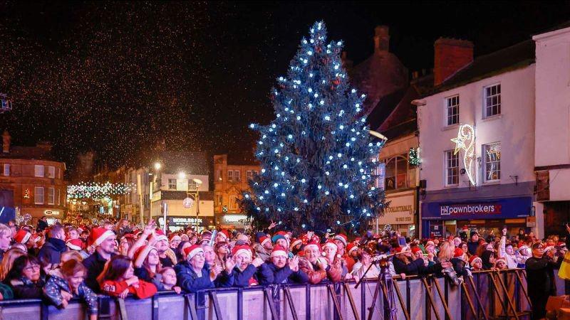 The crowd at the Big Switch On event wearing santa hats