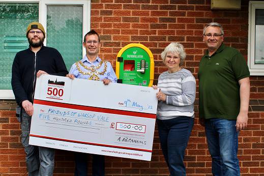 Photo of Mayor with (left to right) Tim Fisher, of Mierce Miniatures, which is funding power to the defibrillator, Sharon Scott, a volunteer with the Friends of Warsop Vale, and Cllr Andy Burgin, ward councillor for Warsop Carrs