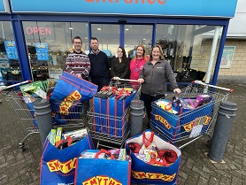 Photo of Mayor and Secret Santa helpers with gifts bought at Smyths Toy Superstore in Mansfield