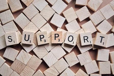 The word support spelt out with scrabble tiles