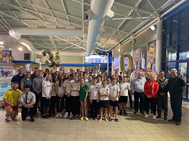 All swim squad members and representatives celebrate 30 year milestone