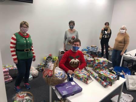 The Mayor and elves wrapping presents