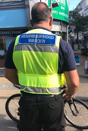 Photo of council Neighbourhood Warden stopping a cyclist