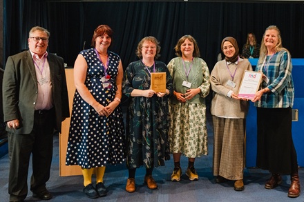 Photo of the Museum team with the two awards