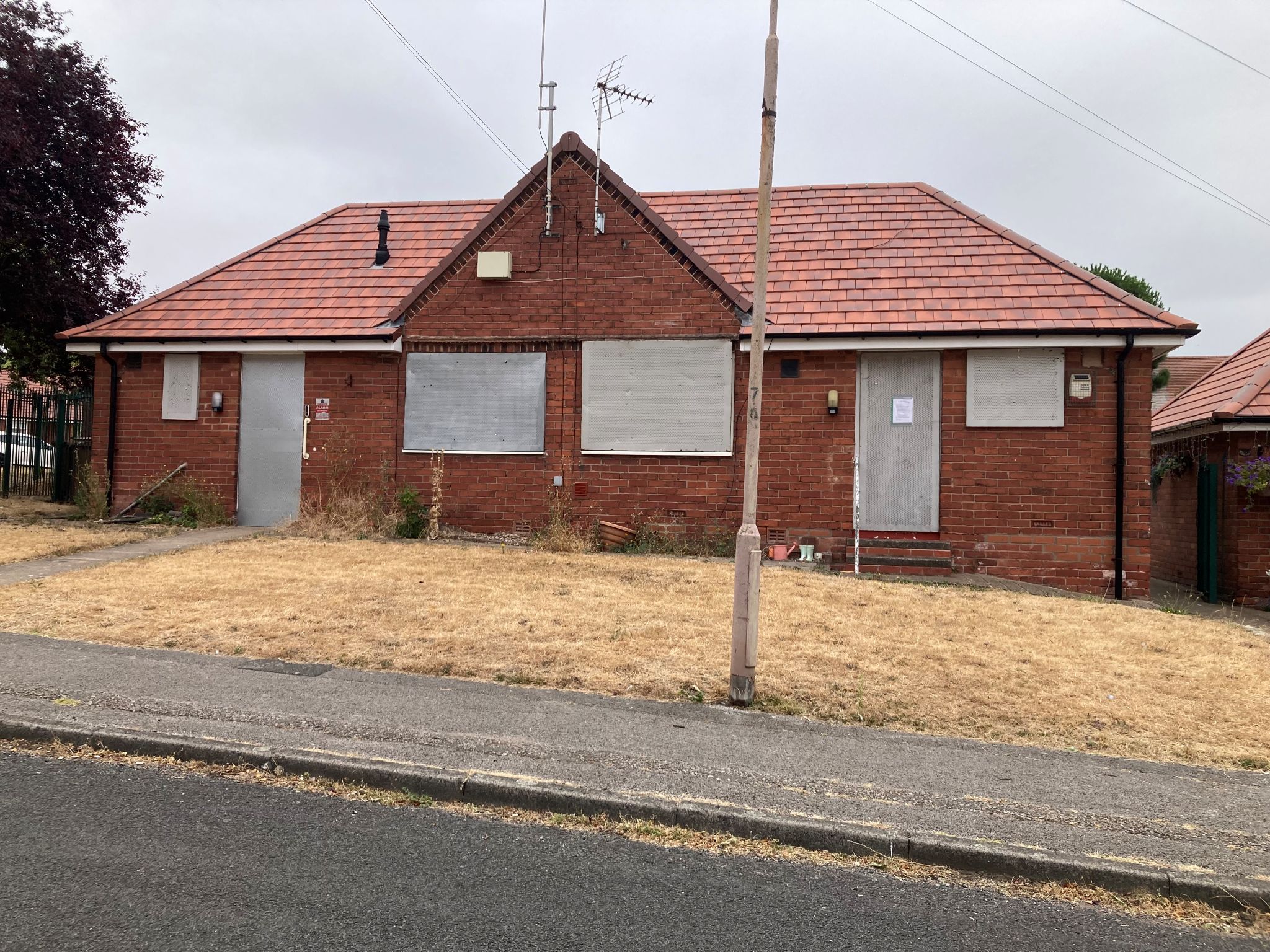 The house on Chaburn Road which has been shut down with boarded doors and windows