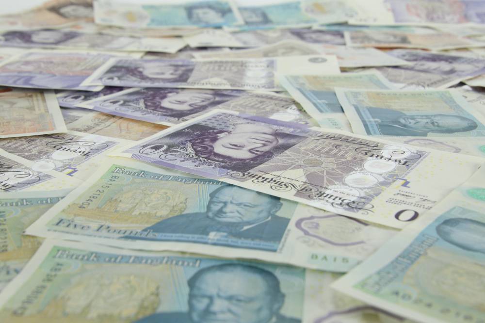 A stock image of money displayed on a table