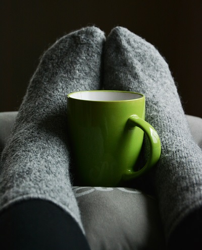 A photo of a mug and some woolly socks