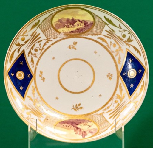 Saucer dish with dark blue and gilt, and panels with landscapes