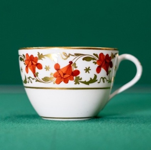 Teacup with broad border of red flowers and gilt leaves