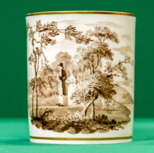 Large ceramic mug with landscape in sepia tones, showing a couple walking in woodland