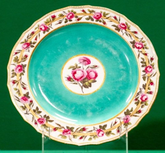 Plate with a turquoise background and a border and centre of roses
