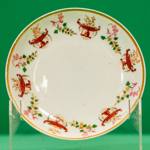 Saucer decorated with urns and garlands