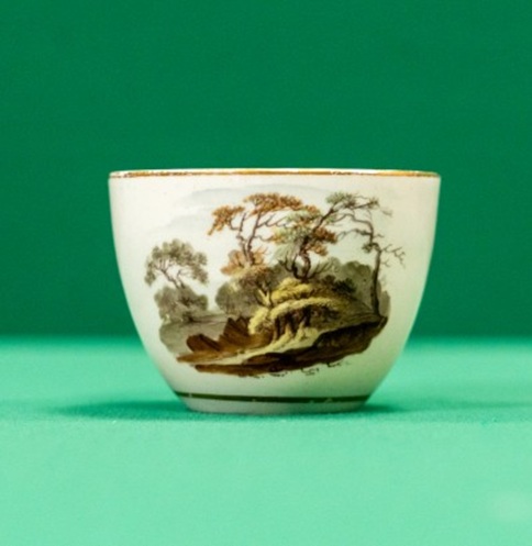 Small teacup with landscape in brown shades
