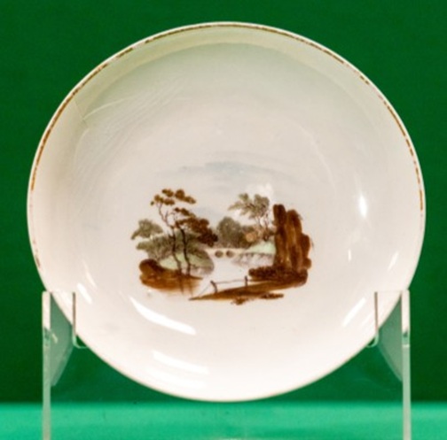 Saucer with landscape in brown shades