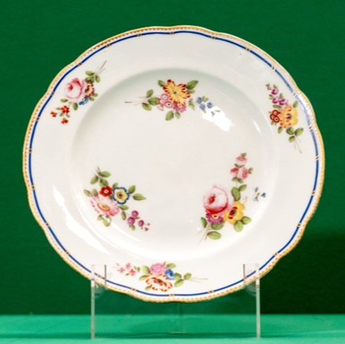 Plate decorated with sprigs of flowers