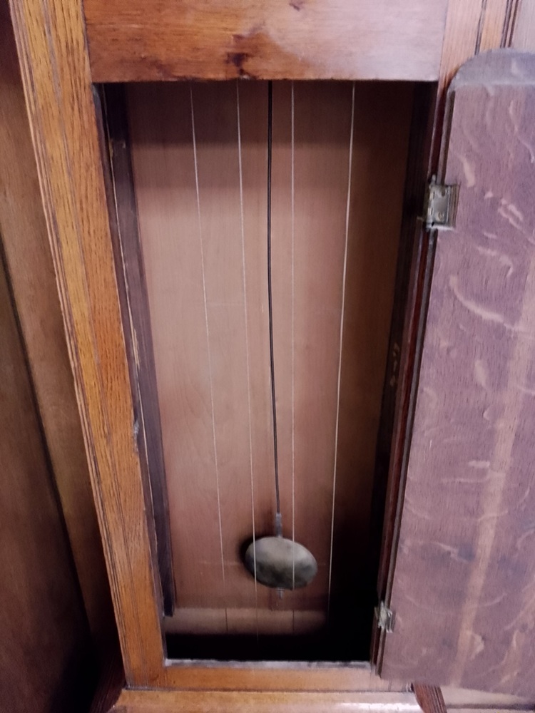 The pendulum in the clock case