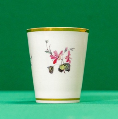 Ceramic beaker decorated with a sprig of flowers
