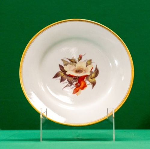 Ceramic plate decorated with a bunch of dog roses