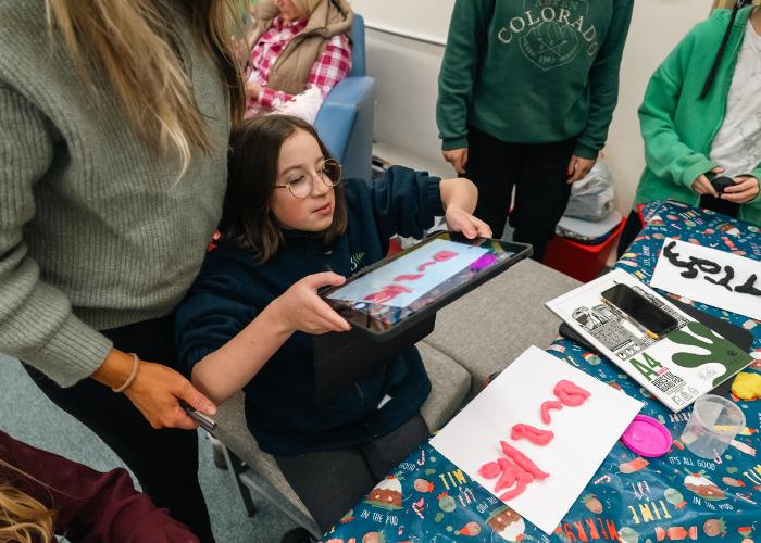 girl using ipad with animation