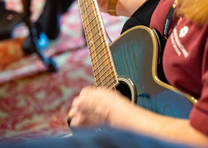 man playing a guitar