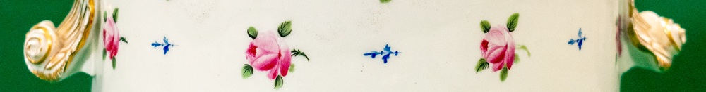 Detail of a porcelain ice pail decorated with painted roses