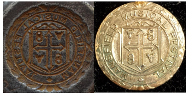 The face of a coining die next to a medal struck from it
