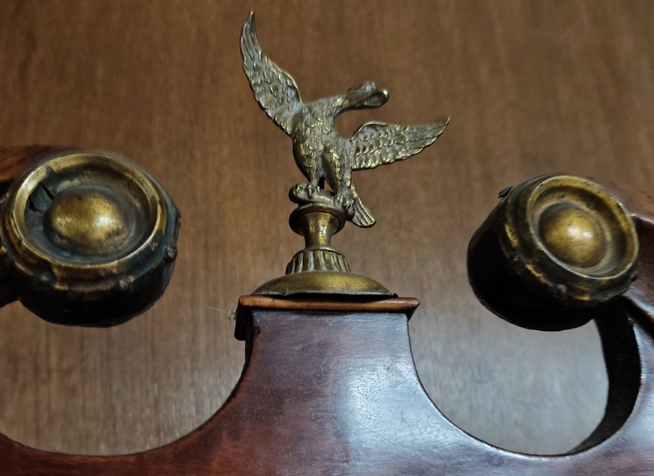 Decorative eagle on top of the clock case
