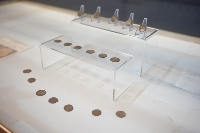 Roman silver coins, displayed in a museum case