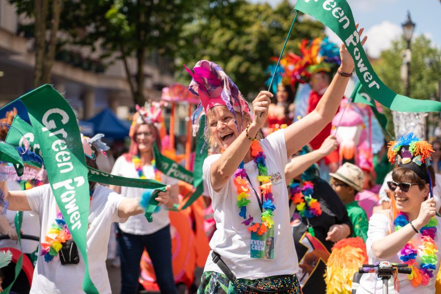 women in carnival costunes dancing in a crowd