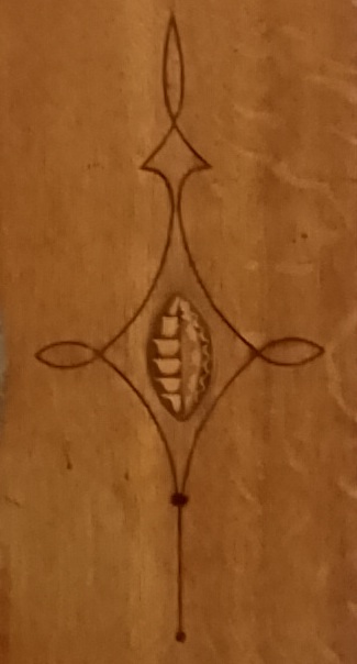 Inlaid designs in the wood of the clock case